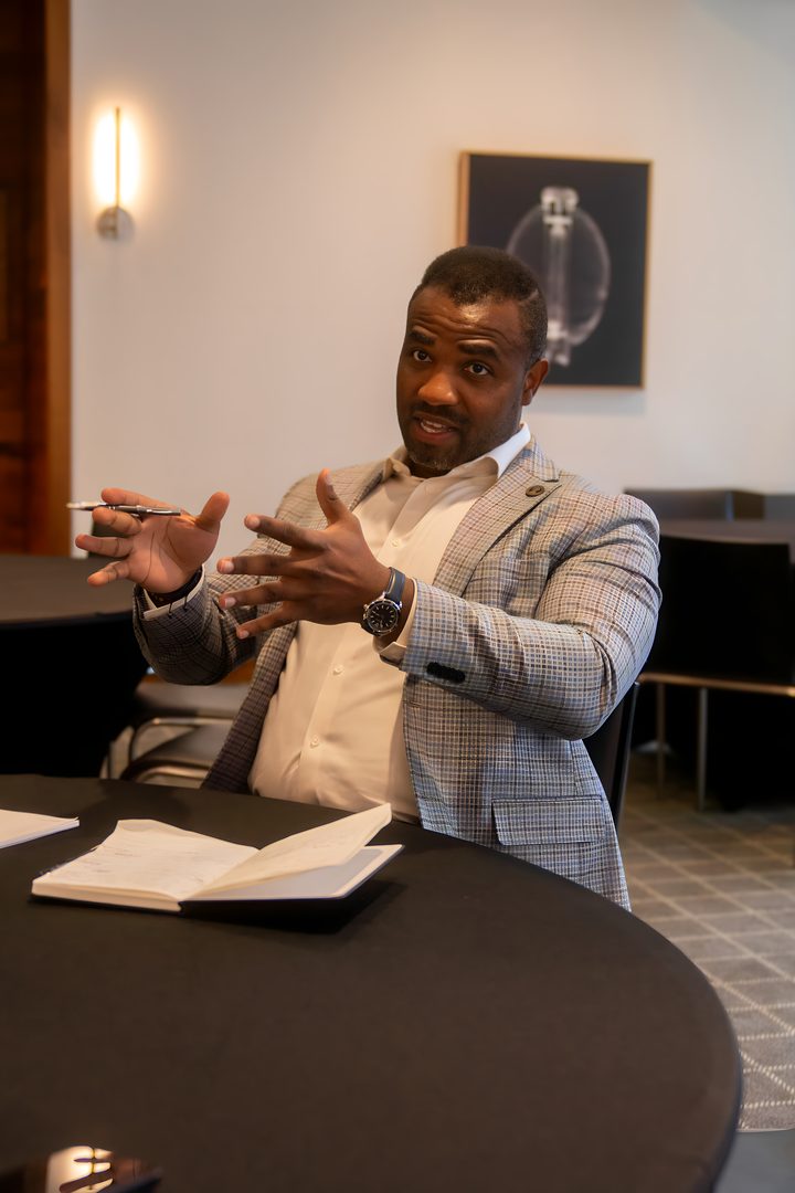 A member sharing an idea at the table