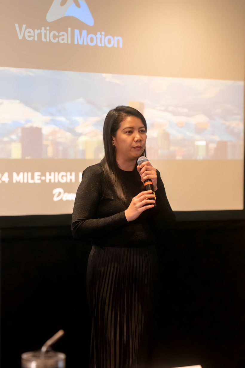 A member presenting the framework at a Vertical Motion event