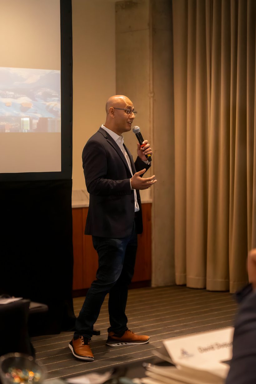 A member presenting with executive presence at a Vertical Motion event