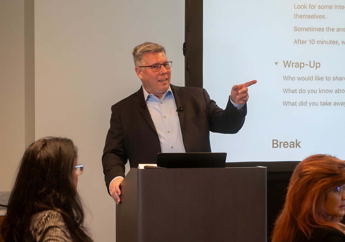 Tom Cox presenting on executive presence at a Vertical Motion event