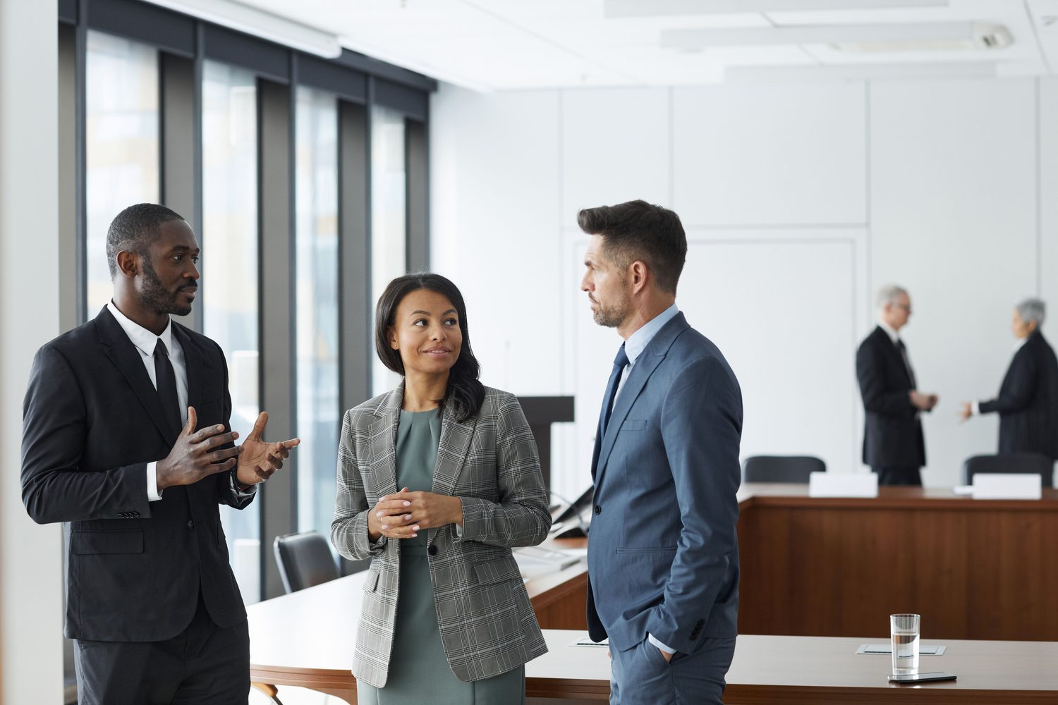 A departing executive shaking hands, moving on to the next role
