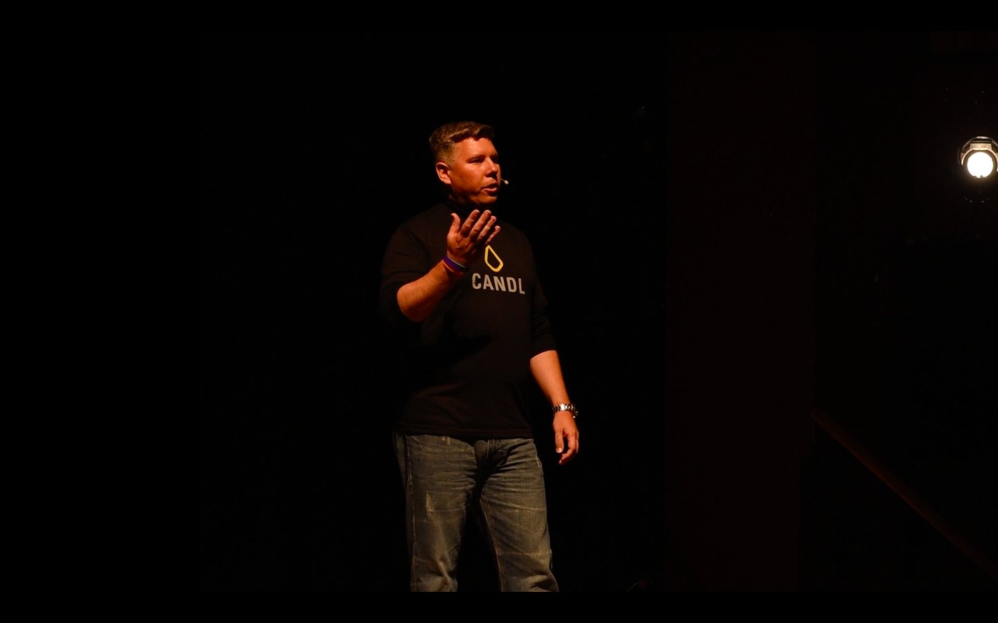 Tom Cox presenting on stage